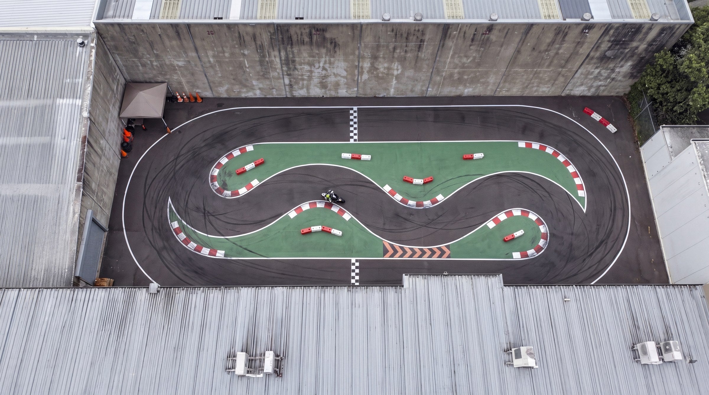 Apex GP rear car park track — serpentine MiniGP circuit, aerial view